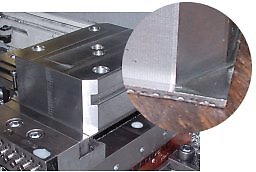 In machining CenterCompact vise bodies, only 0.08 (2 mm) of the raw material is held in PositiveLock vise jaws. The body is completely machined on 5 sides, and then conventionally clamped to remove the extra 0.08 of material.