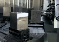 CenterCompact vises and QuickPoint base plates used on a rotary table.